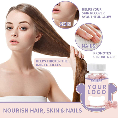 A saúde do cabelo suplementa a biotina das vitaminas das mulheres a extensão cor-de-rosa do cabelo do veganformula do ácido fólico dos gummies do urso de peluche